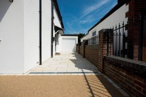 Side access driveway laid with natural stone